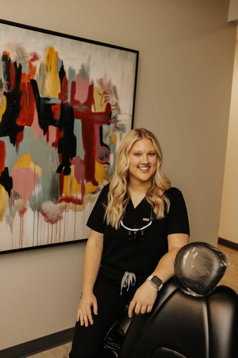 Smiling Buffalo Creek Dental team member — straighten your teeth with Invisalign in Mustang, OK