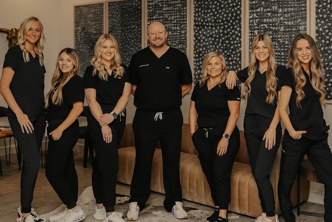 Dr. Jon Barnes and the Buffalo Creek Dental team in the lobby of our Mustang, OK office