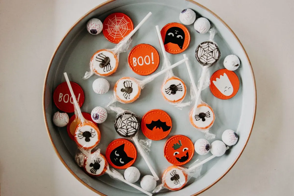 Bowl of Halloween candy and lollipops, a reminder to plan ahead for your kids' teeth