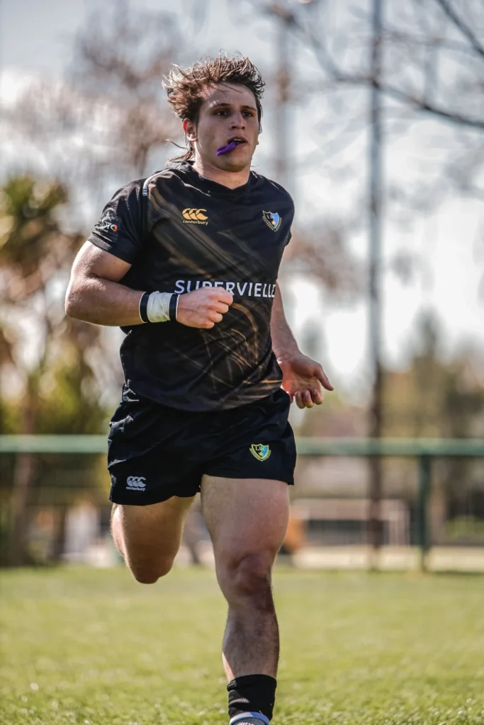 An athlete wearing a sports mouthguard